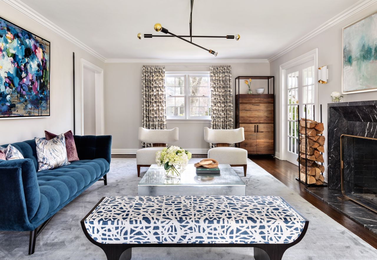 a living room with a dark blue sofa