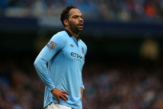 Joleon Lescott of Manchester City looks on during the Barclays Premier League match between Manchester City and Arsenal at Etihad Stadium on September 23, 2012 in Manchester, England.