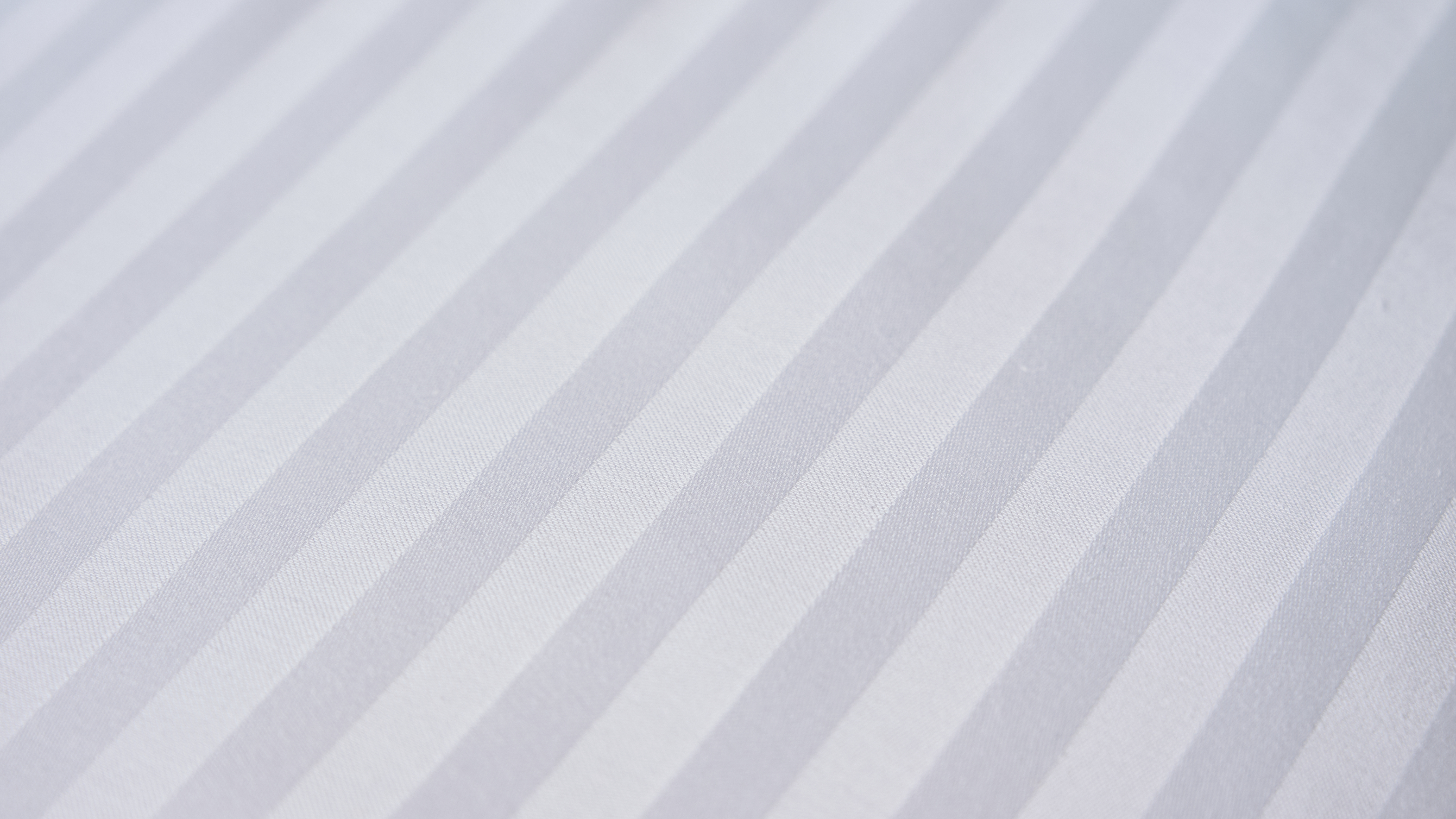 A close-up shot of the cotton cover encasing the Beckham Hotel Collection Down-Alternative pillow