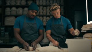 From left to right: Lionel Boyce as Marcus and Will Poulter as Luca both rolling dough in The Bear.