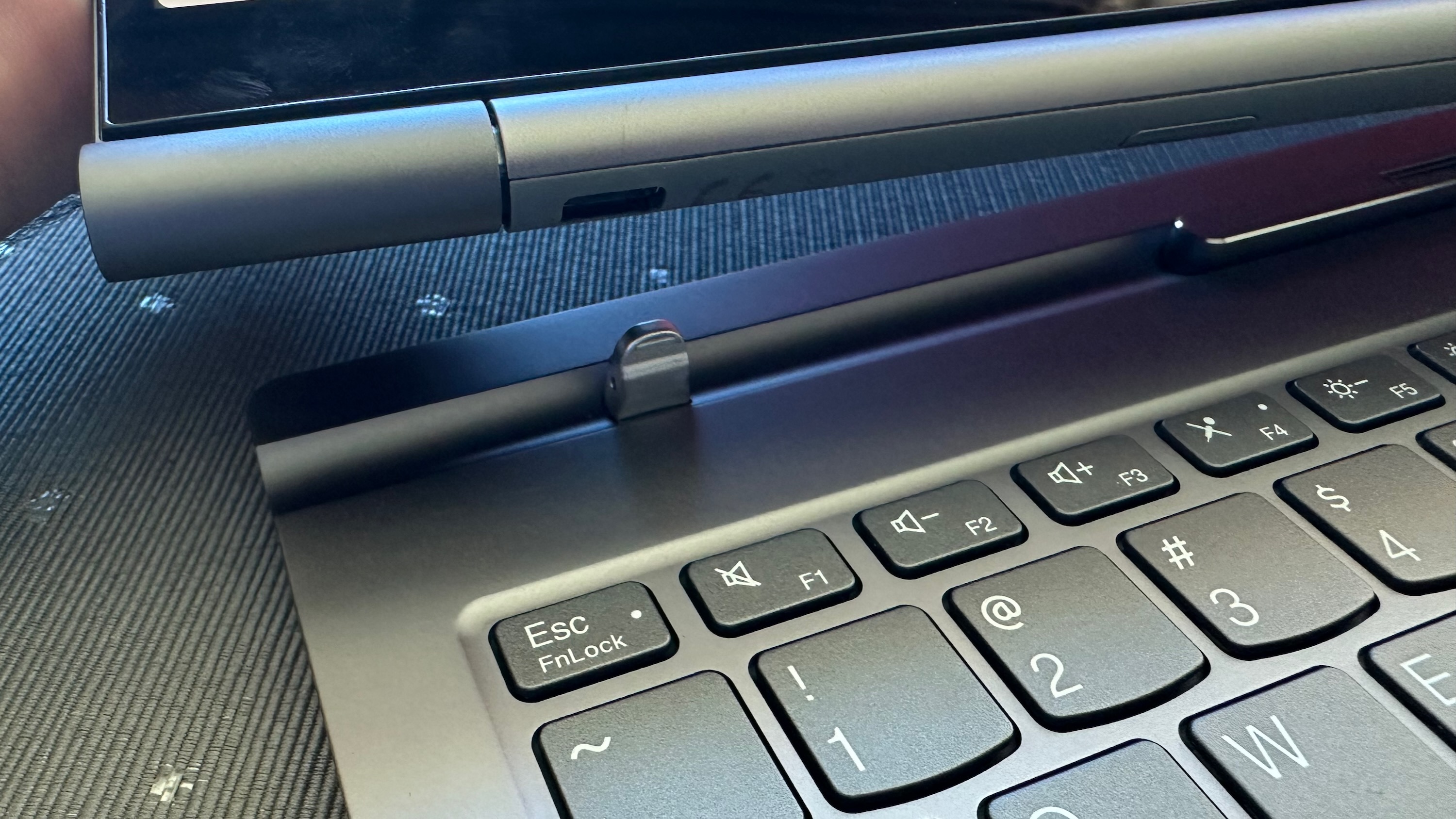 A close-up of the magnetic attachment tool on the Lenovo ThinkBook Plus Gen 5 Hybrid
