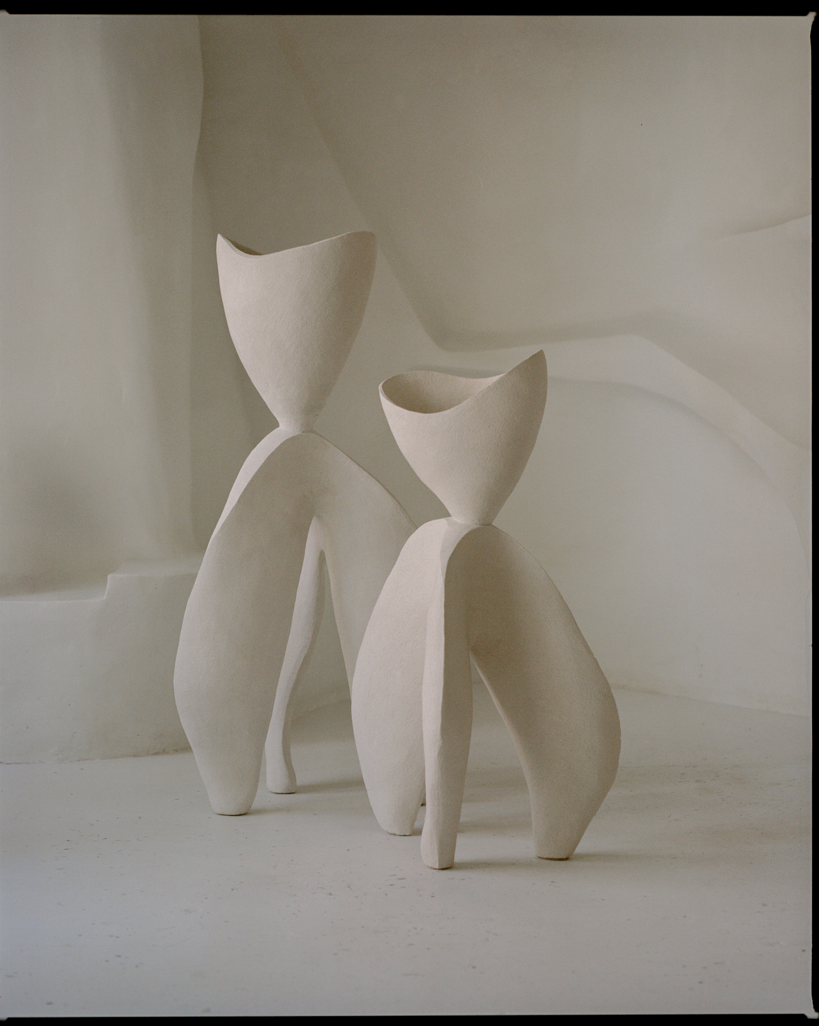 white ceramic vessels by simone bodmer-turner
