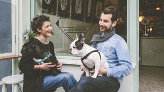 French bulldogs and their owners in cafe