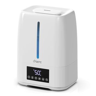 A small white humidifier with a black control panel on the front. 