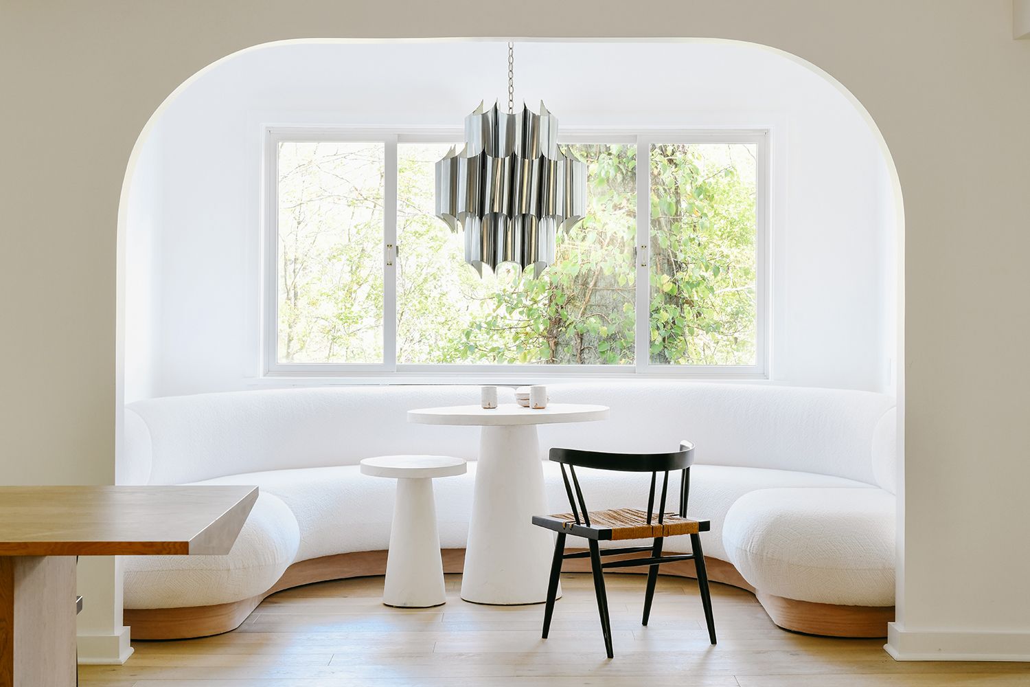 white built in banquette in a window