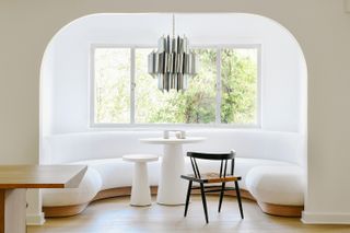 white built in banquette in a window