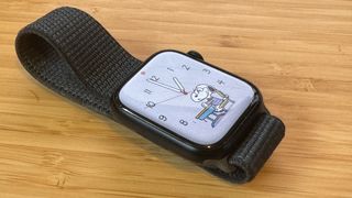 A Midnight Apple Watch Series 9 sitting on a desk