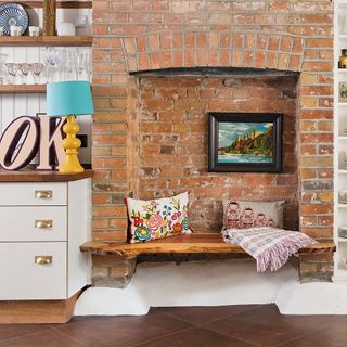 fire place bench with bricked wall and drawer