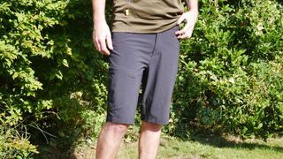 A model wears Gore Explore mountain bike shorts viewed from the front