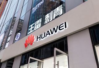 Huawei logo displayed on a shopfront