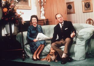 Prince Philip and the Queen with one of her corgis at Sandringham