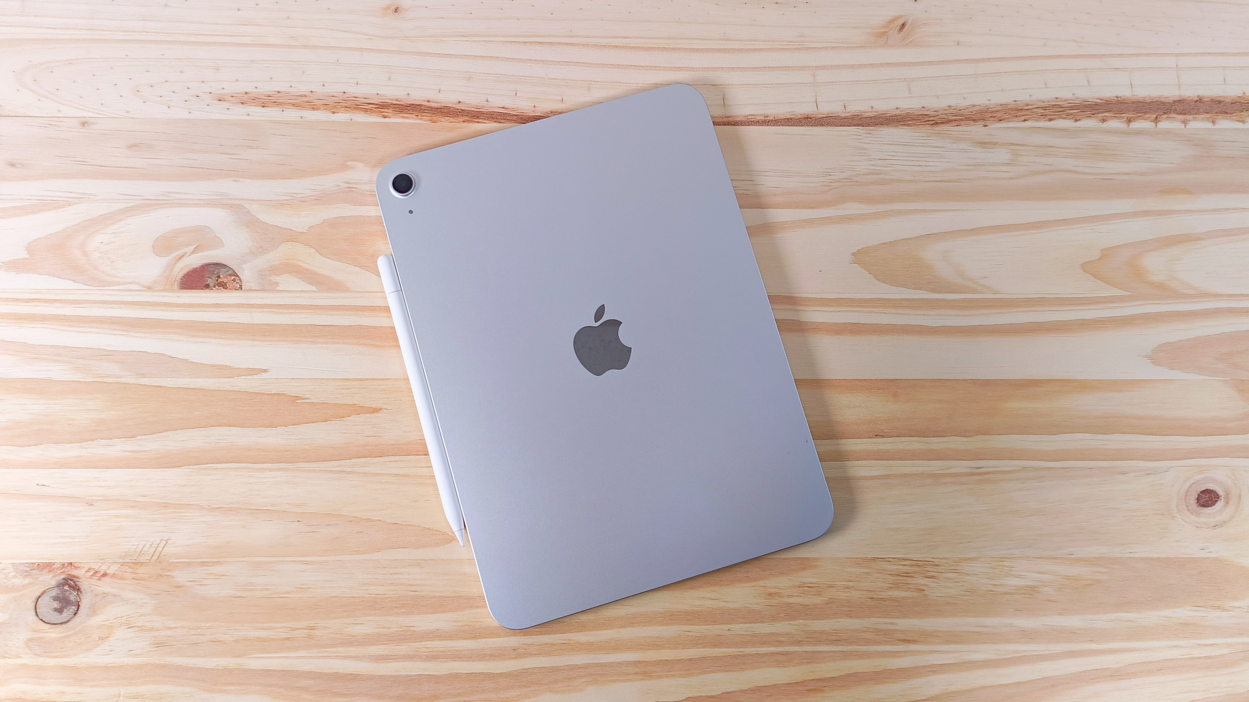 The back of the iPad 11 seen from above on a wood table