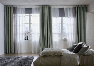 double up curtains with light sheer layer and a thicker curtain to block light like this set from Ikea