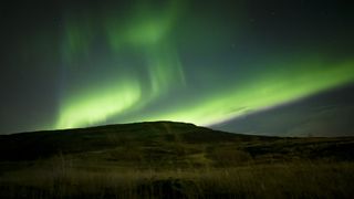 The Aurora's green lights dancing over Iceland