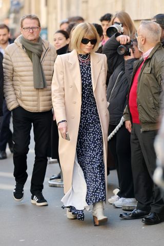 Anna Wintour wears snake-print boots in Paris.