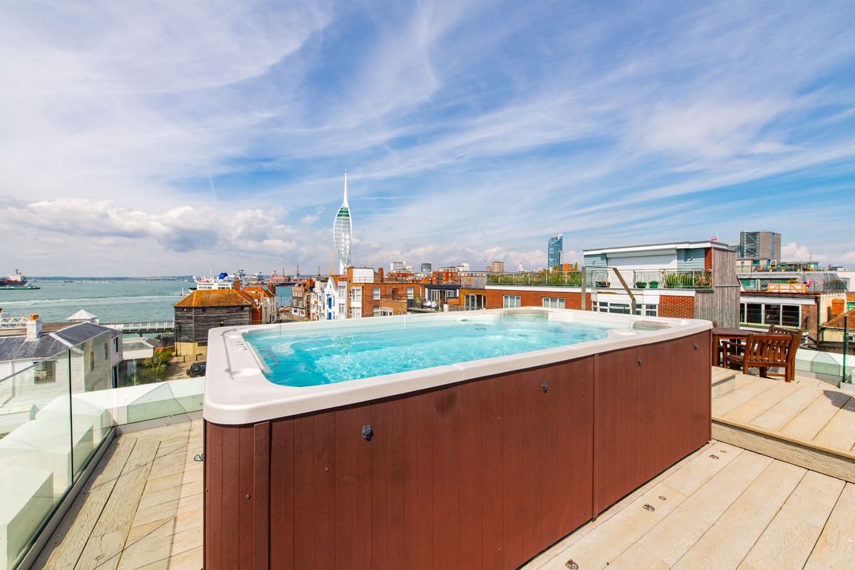 The hot tub has views of the Spiral Tower in Portsmouth