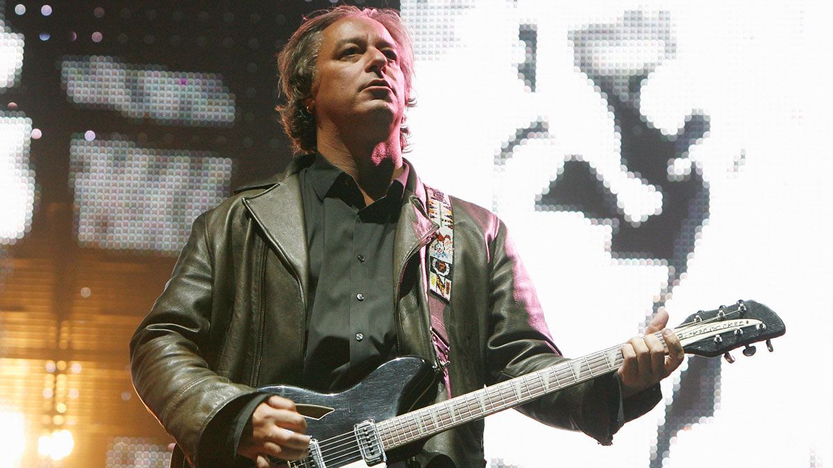 Photo of Peter BUCK and REM, Peter Buck performing on stage