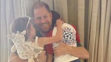 A screenshot of Meghan Markle's Instagram post for Father's Day, featuring Prince Harry hugging Archie and Lilibet