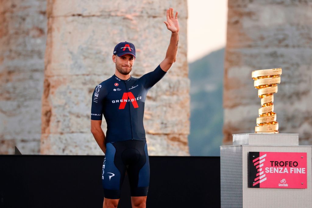 Team Ineos rider Italys Filippo Ganna waves on stage at the Doric Temple of Segesta near Palermo Sicily on October 1 2020 during an opening ceremony of presentation of participating teams and riders two days ahead of the departure of the Giro dItalia 2020 cycling race Photo by Luca Bettini AFP Photo by LUCA BETTINIAFP via Getty Images