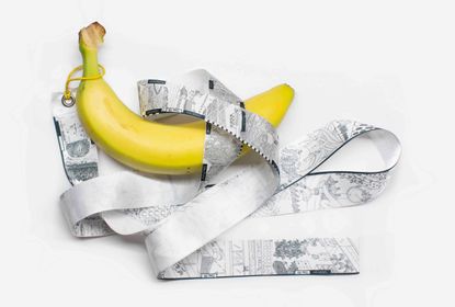 Banana wrapped in a 'made in' label referring to its long journey to the consumer