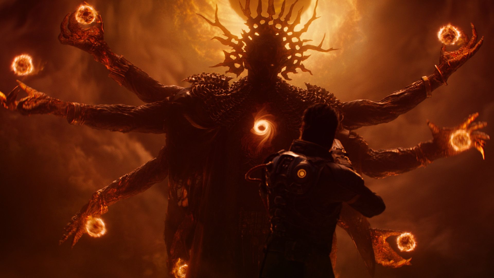 Arjun facing a large monster with fireballs on its hands during the new game Saros. 