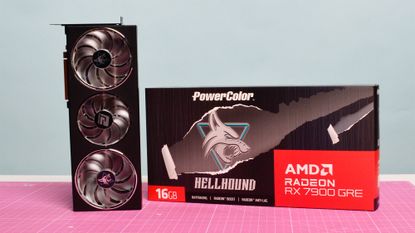 An AMD Radeon RX 7900 GRE from PowerColor on a desk with its retail packaging