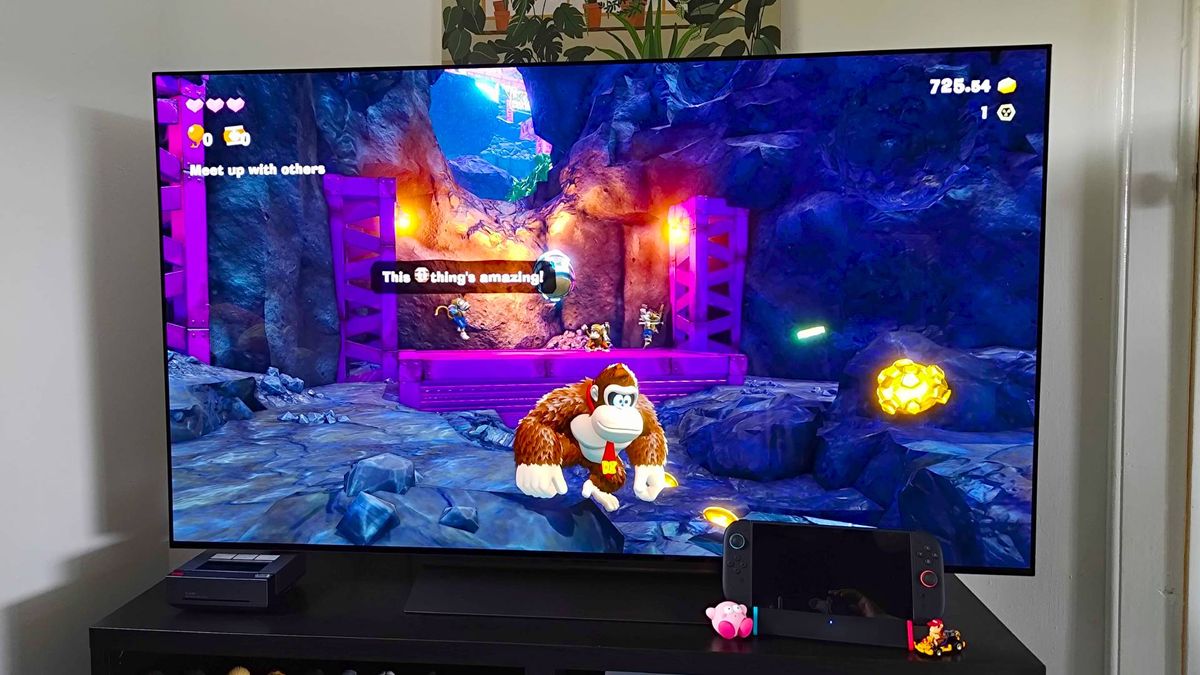 SIWIQU Switch 2 dock connected to LG OLED C4 TV with Donkey Kong Bananza gameplay on screen.
