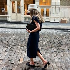 @elizagracehuber wearing black dress, white pillbox hat, black heels