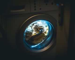 A washing machine with full load used in evening / night