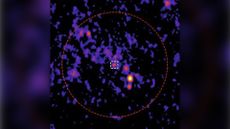 The team identified a new radio source (white square) in the center of an ancient globular cluster (red circle).