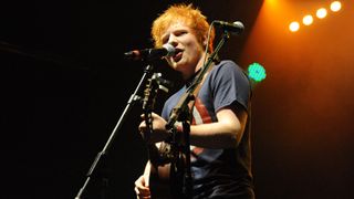 Photograph of Ed Sheeran performing live on stage