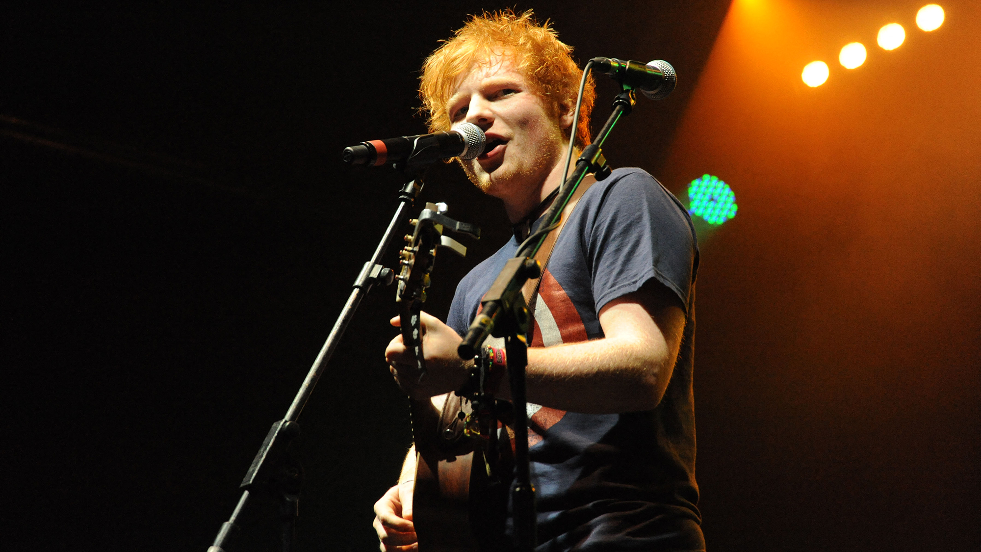 Photograph of Ed Sheeran performing live on stage