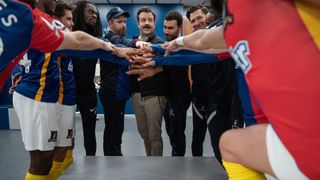 A team huddle in the dressing room in Ted Lasso