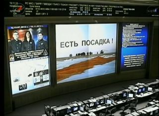 This still from a NASA TV broadcast shows the inside of Russia's Mission Control Center near Moscow just after the successful landing of a Soyuz TMA-05M capsule carrying the station's Expedition 33 crew on Nov. 18, 2012, EST.