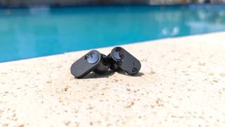 Hero image for best earbuds under $100 with water dripping from the OnePlus Nord Buds