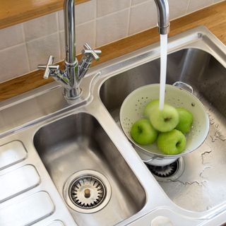 Apples washed in a kitchen sink