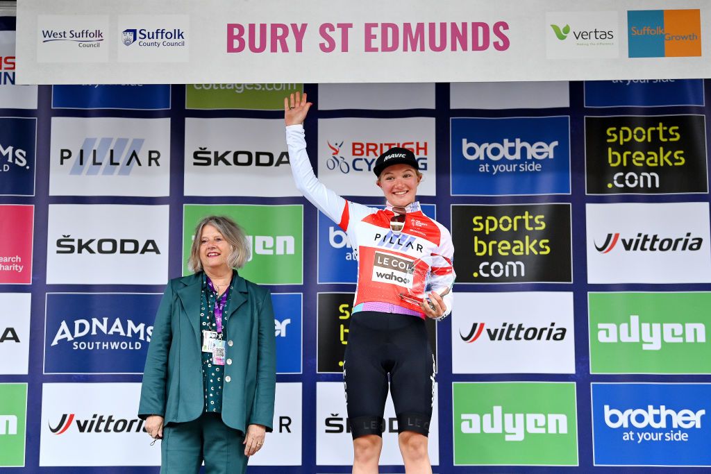 BURY ST EDMUNDS ENGLAND JUNE 06 Maike Van Der Duin of Netherlands and Team Le Col Wahoo celebrates winning the red sprints leader on the podium ceremony after the 8th The Womens Tour 2022 Stage 1 from Colchester to Bury St Edmunds WomensTour UCIWWT on June 06 2022 in Bury St Edmunds England Photo by Justin SetterfieldGetty Images
