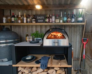 A pizza oven station set up in a garage