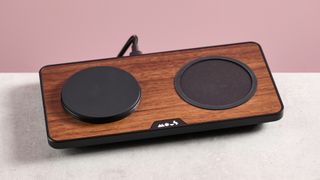 The Mous Charging Station with Qi2 sits at a slight angle on a light grey surface.