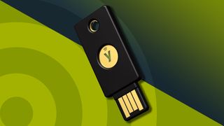 A Yubico YubiKey 5 NFC, the best security key of 2024, against a techradar background