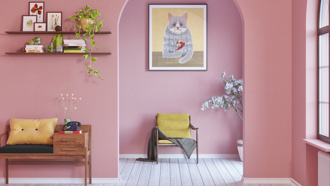 Living room painted in Wes Anderson colour scheme of pale pink, with pops of yellow and green throughout