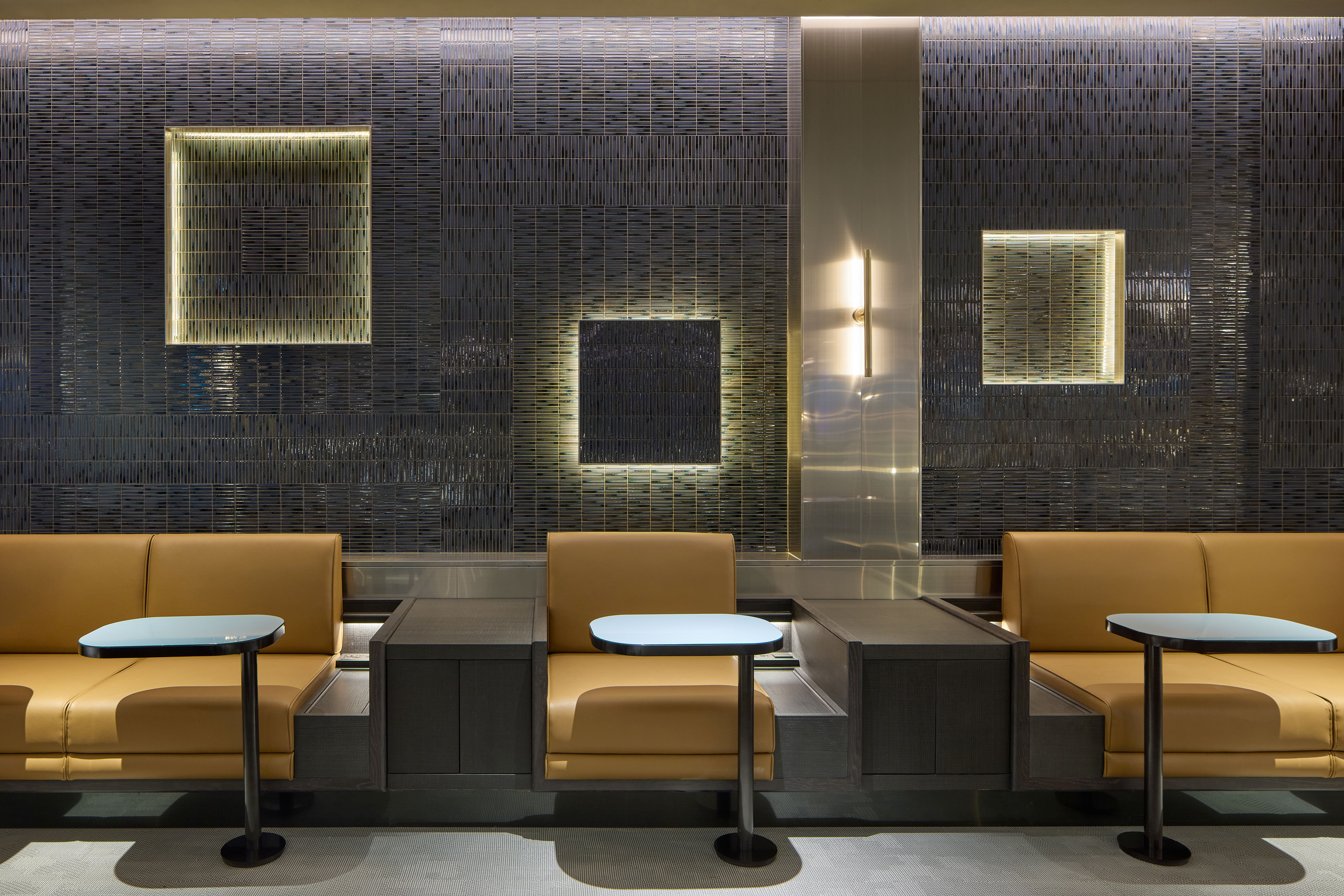 A spacious lounge interior at Incheon International Airport combines contemporary furnishings, natural textures and distinct areas for dining, work and relaxation