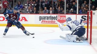 Valeri Nichushkin #13 of the Colorado Avalanche takes a shot on Andrei Vasilevskiy #88 of the Tampa Bay Lightning during the second period in 2022 NHL Stanley Cup Final