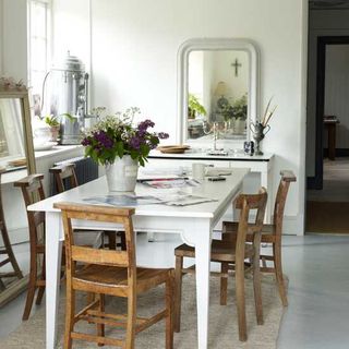 dining room with white dining table and chairs