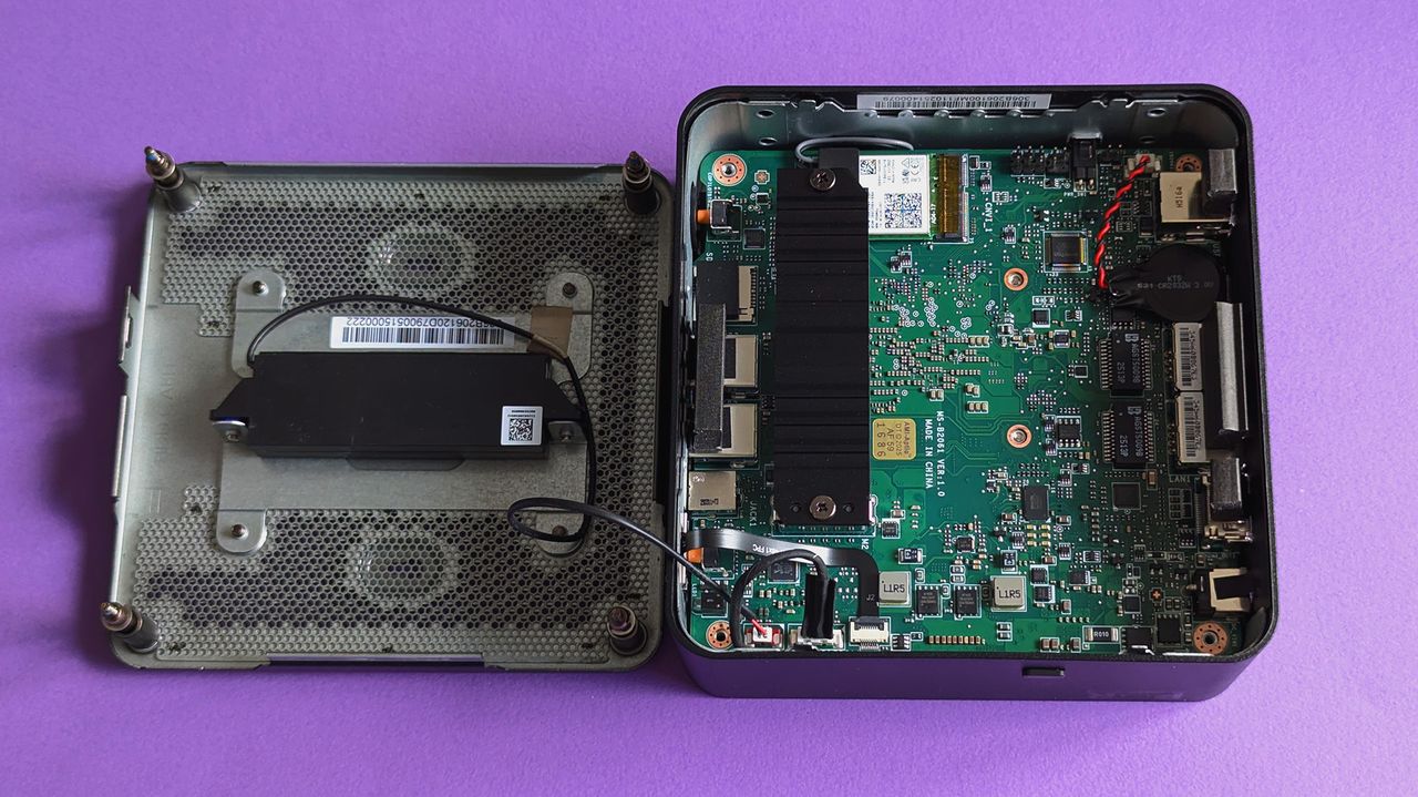 MSI Cubi NUC AI+ 2MG mini PC on a purple card stock background