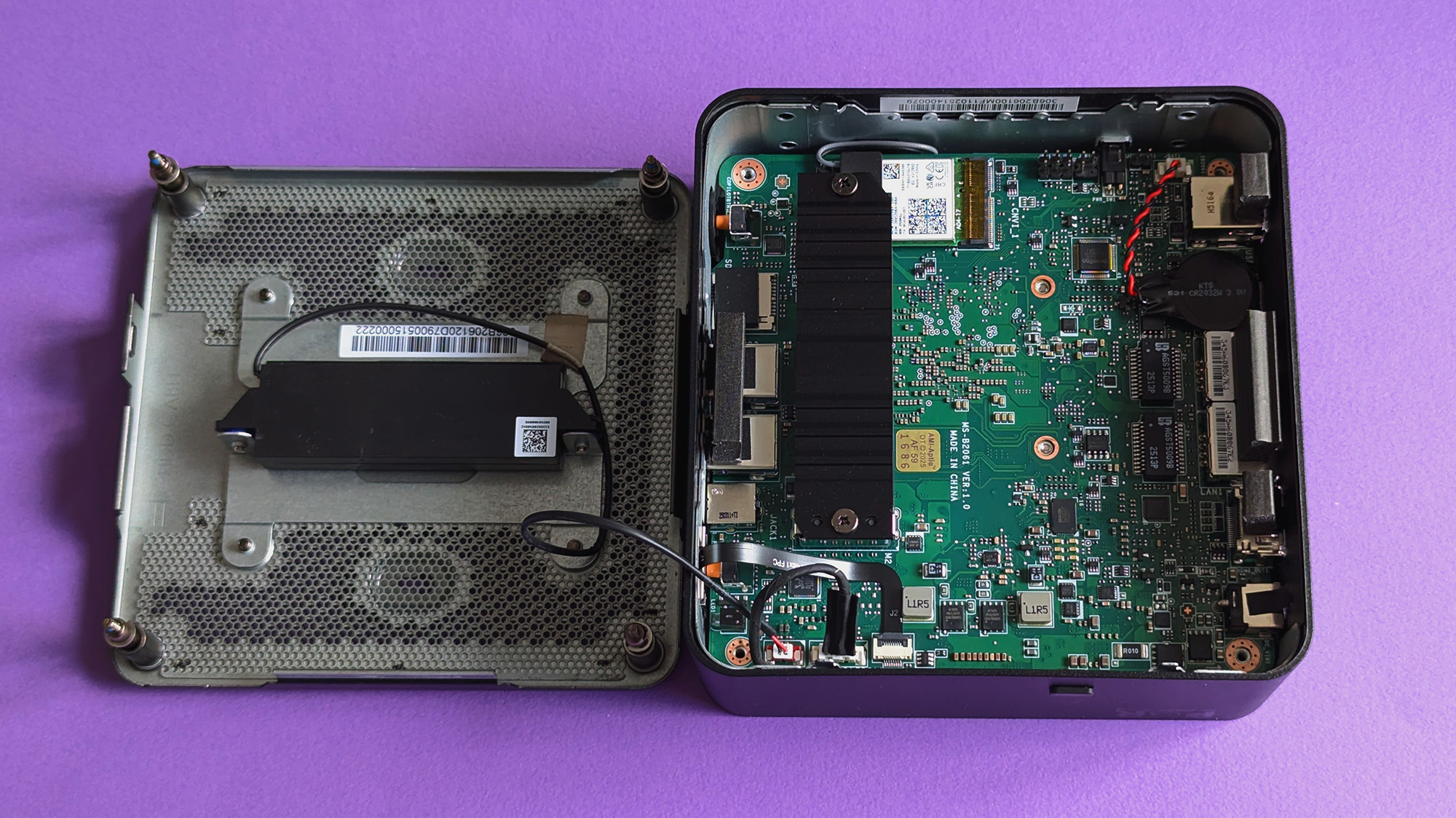 MSI Cubi NUC AI+ 2MG mini PC on a purple card stock background