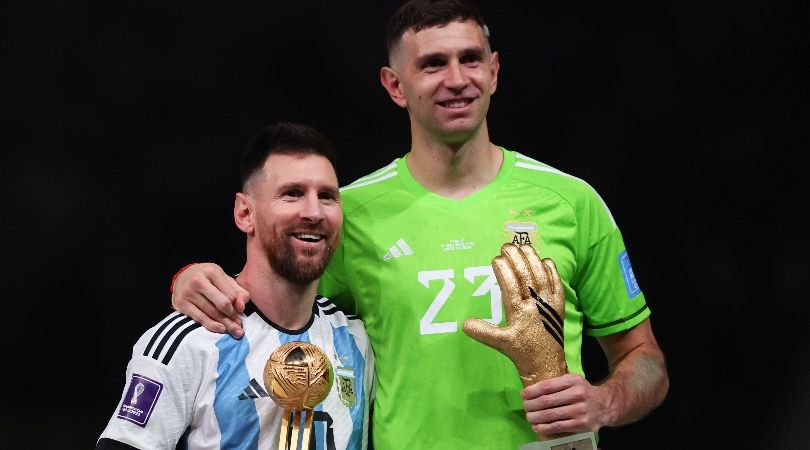 Lionel Messi and Emiliano Martinez with their individual trophies after winning last year&#039;s World Cup final with Argentina.