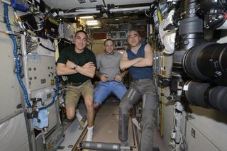 The International Space Station's Expedition 63 are isolating themselves in the outpost's Russian segment as engineers work to isolate a small air leak in another module. From left: Cosmonaut Ivan Vagner of Roscosmos, NASA astronaut Chris Cassidy and cosmonaut Anatoly Ivanishin.