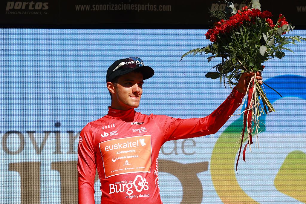 POZA DE LA SAL SPAIN AUGUST 16 Xabier Berasategi Garmendia of Spain and Team EuskaltelEuskadi celebrates at podium as Red Mountain Jersey winner during the 45th Vuelta a Burgos 2023 Stage 2 a 131km team time trial from Oa to Poza de la Sal on August 16 2023 in Poza de la Sal Spain Photo by Gonzalo Arroyo MorenoGetty Images