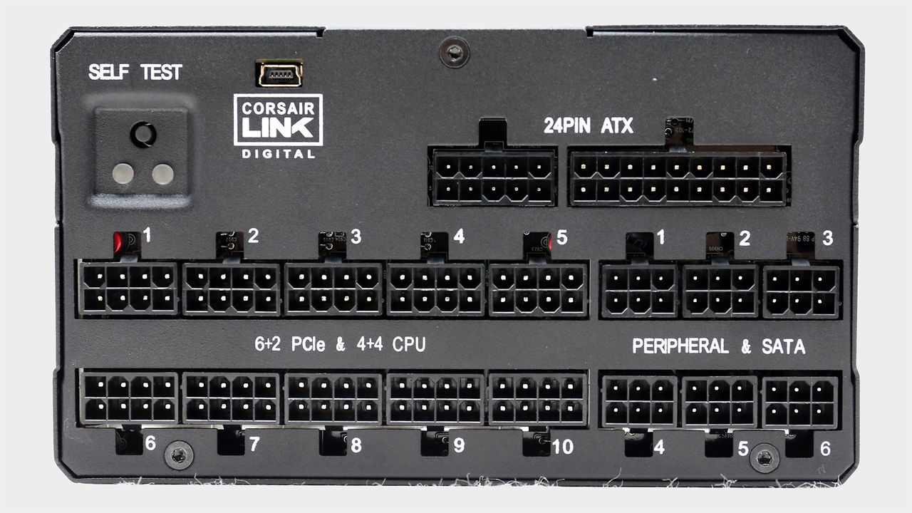 Corsair AX1600i power supply with cables.